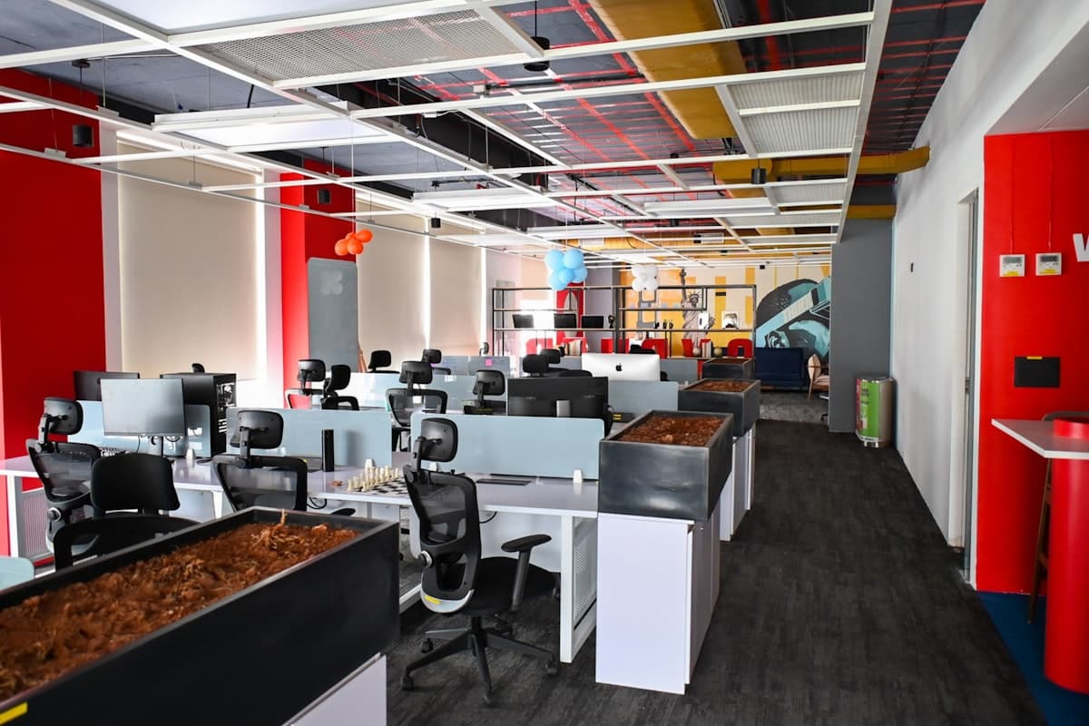 Modern open-plan office space with clean desks and workstations